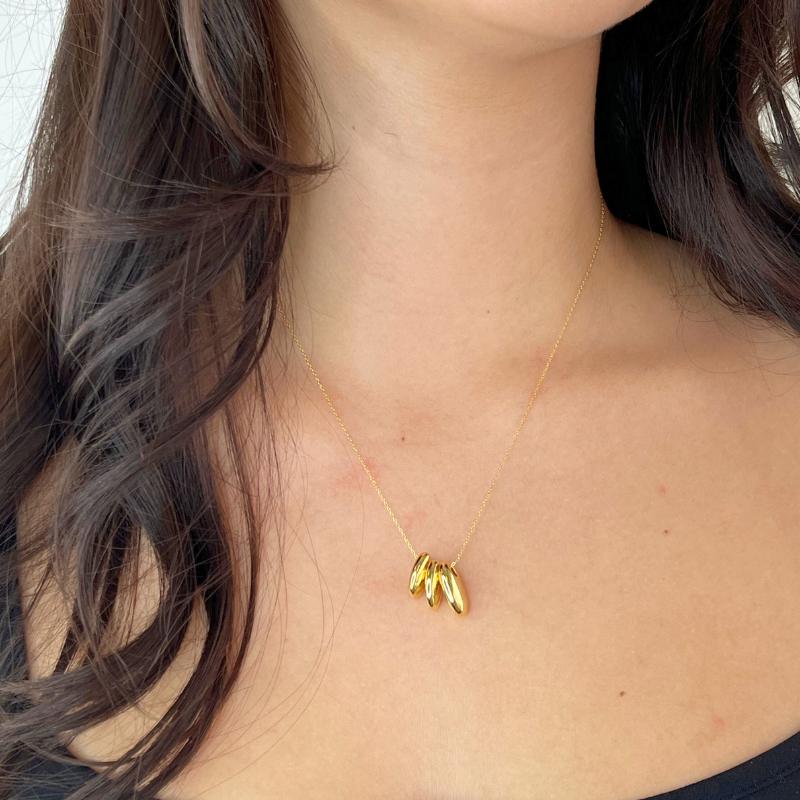 tai triple gold puffy oval necklace