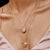 satya gold compassion rose quartz necklace